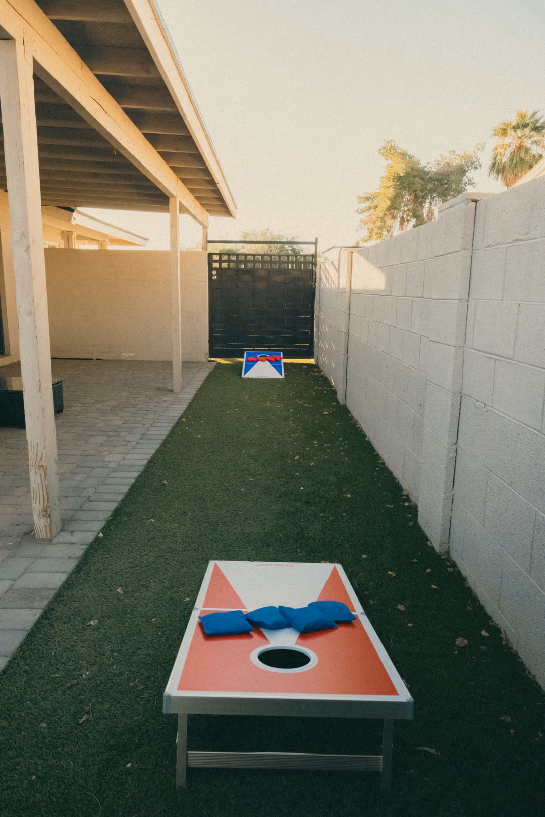 Short-term rental game area with cornhole